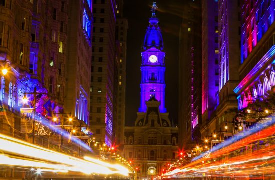 Philadelphia's City Hall and the Avenue of the Arts in patriotic red and blue lights.