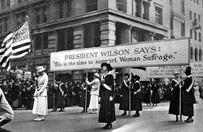 Women protesting in the early 20th century, touting support from President Woodrow Wilson for their right to vote.