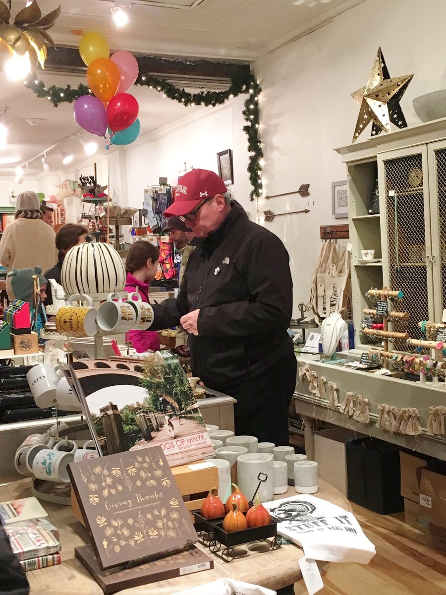 Mayor Jim Kenney shops at The Little Apple Shop in Manayunk during a tour of independent shops during Small Business Saturday in 2016, which occurs annually the Saturday after Thankgsiving.