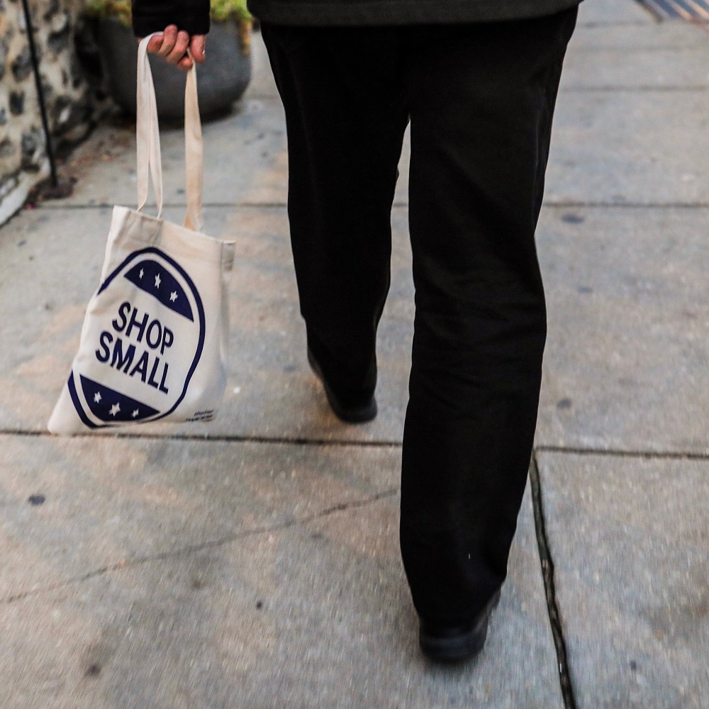 A shopper walks along Main Street in Manayunk on Small Business Saturday in 2016. The annual event occurs on the Saturday after Thanksgiving and celebrates small businesses by encouraging folks to shop locally.
