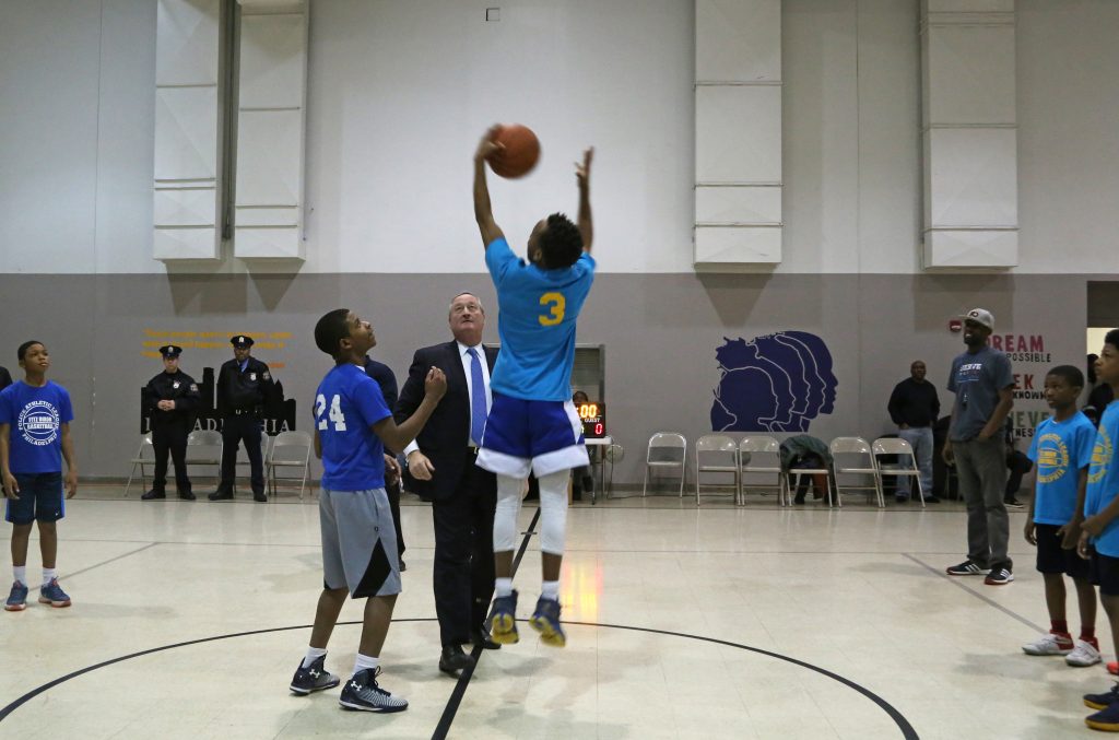 Mayor Kenney tosses ball at Grays Ferry PAL Basketball Playoff Game on February 16.