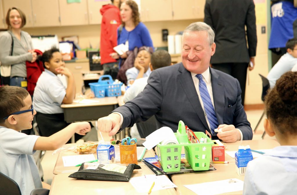 Mayor Kenney fist pumps a student at H.A. Brown Elementary School during his visit or National School Breakfast Week.