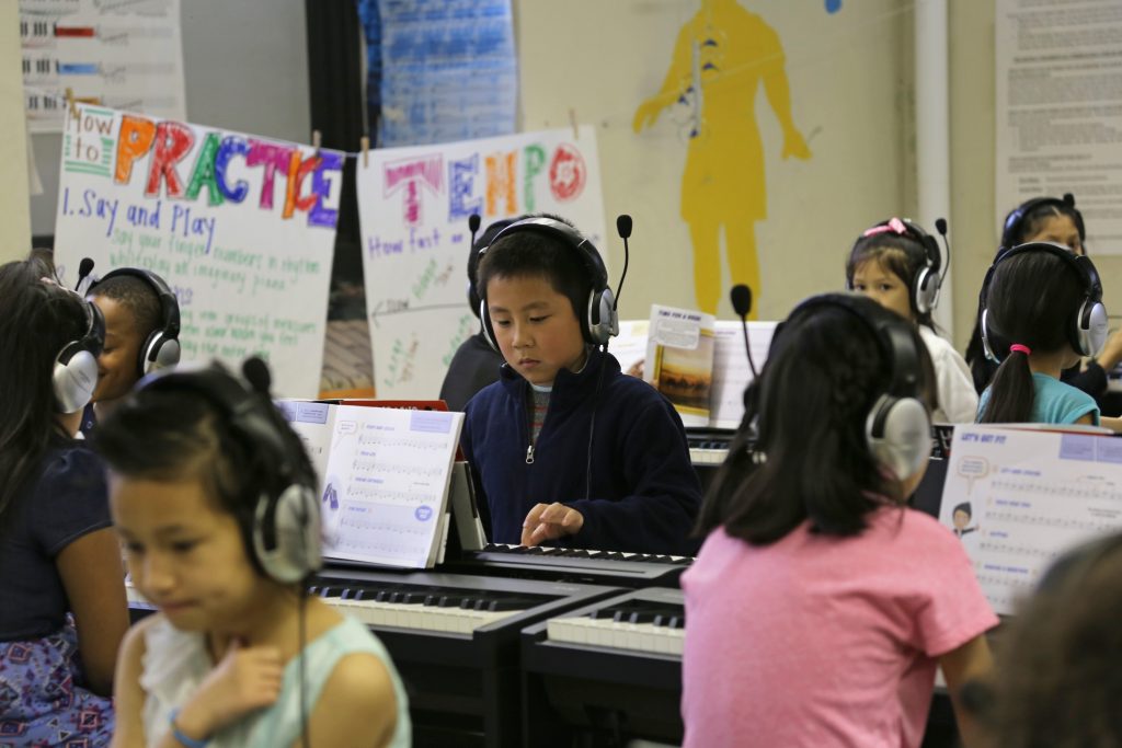 Students perform during the Keys of Inspiration Piano Lab Ribbon-Cutting at Southwark School.