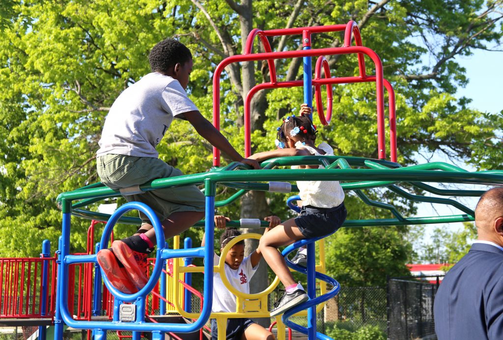 Kids play on jungle gym as Mayor Kenney visits Tustin Playground