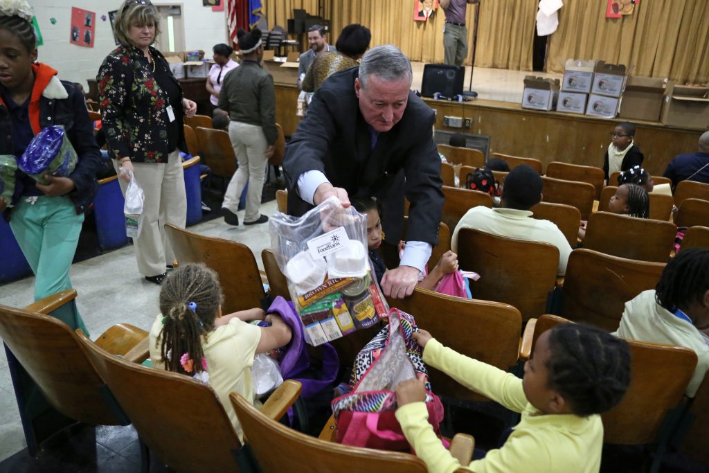Mayor Kenney helps distribute food backpacks at Gideon