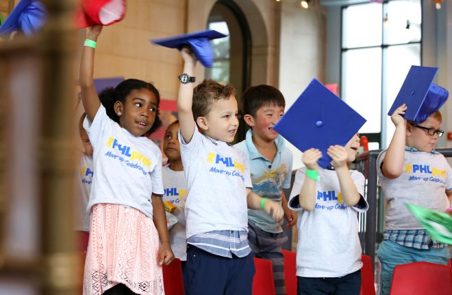 PHLpreK students who have completed pre-K and are heading to Kindergarten wave their caps at the PHLpreK Move Up Day