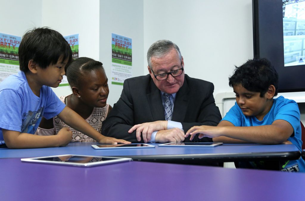 Mayor Kenney learns to play Minecraft during the announcement the launch of the First Annual Block by Block Party on July 20th.
