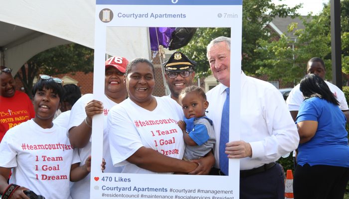 Mayor Kenney, Philadelphia Police and South Philadelphia residents pose for a photo during National Night Out.