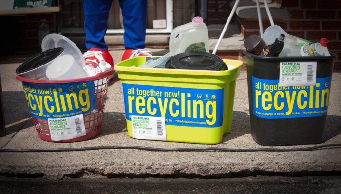 Colorful bins with recycling stickers