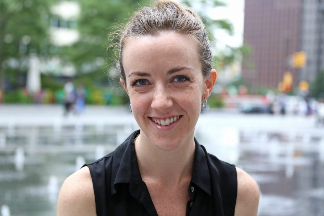 Katharine Miller smiles in front of the fountains in Dilworth Park.