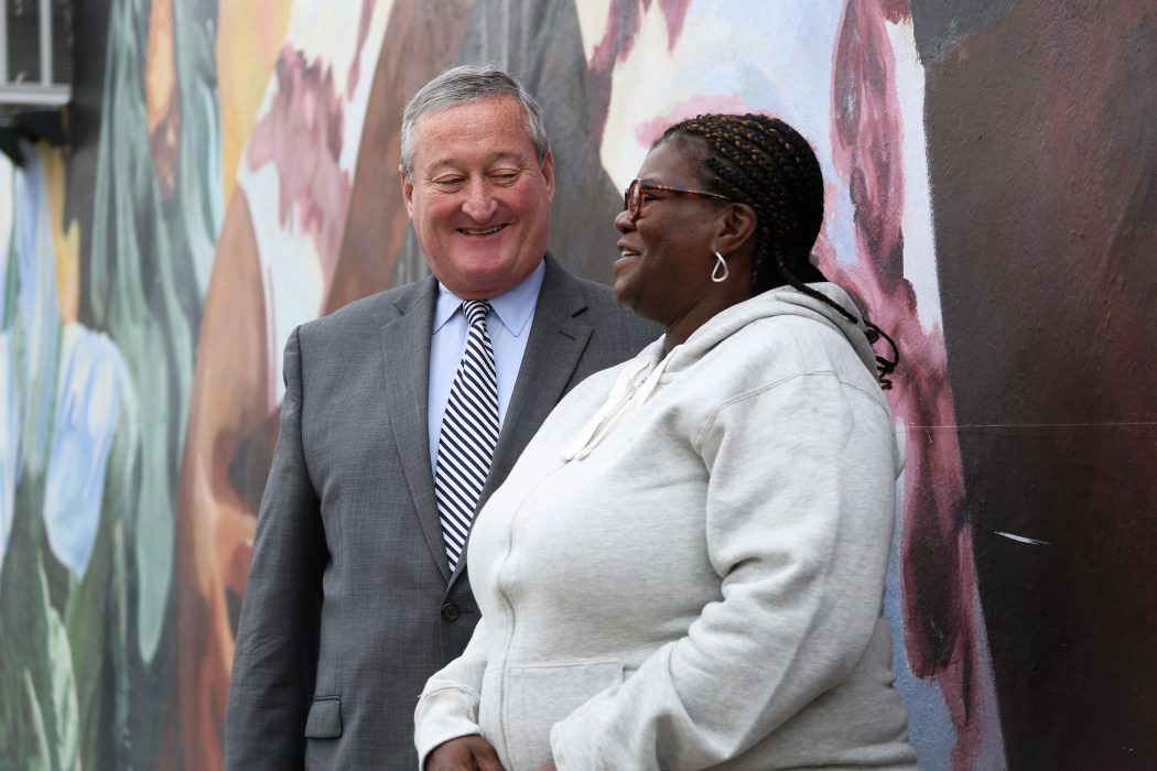 A constituent stops to speak to Mayor Kenney during his Facebook Live interview 