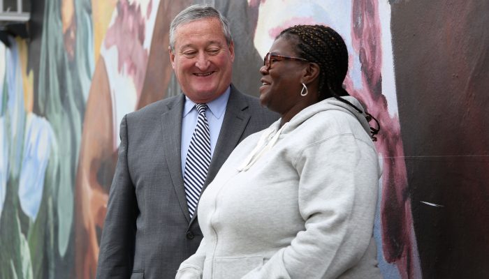 A constituent stops to speak to Mayor Kenney during his Facebook Live interview
