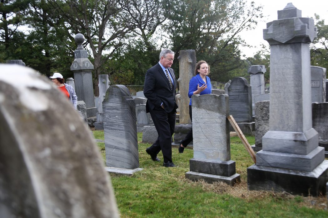 Mayor Kenney observes repairs during a tour Mt. Carmel Cemetery 