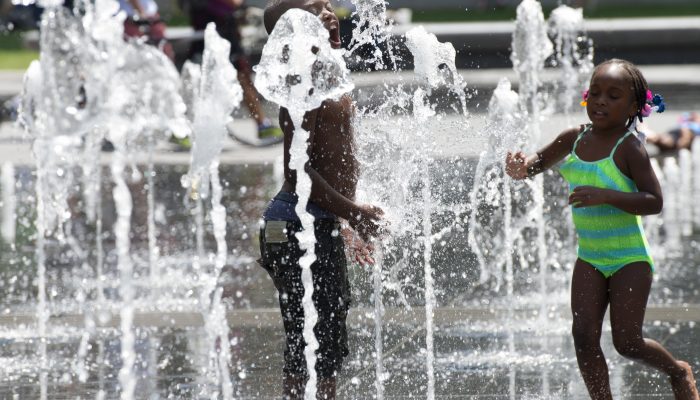 Kids playing in Dilworth Plaza to beat the heat.