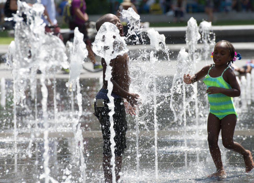 Kids playing in Dilworth Plaza to beat the heat.
