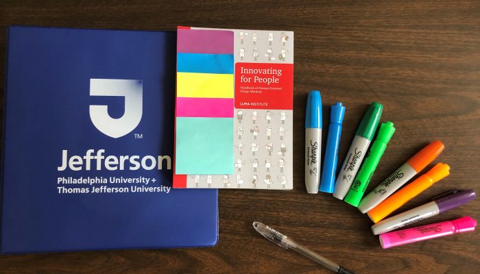 Jefferson University books used at Academy classes laid on a desk.