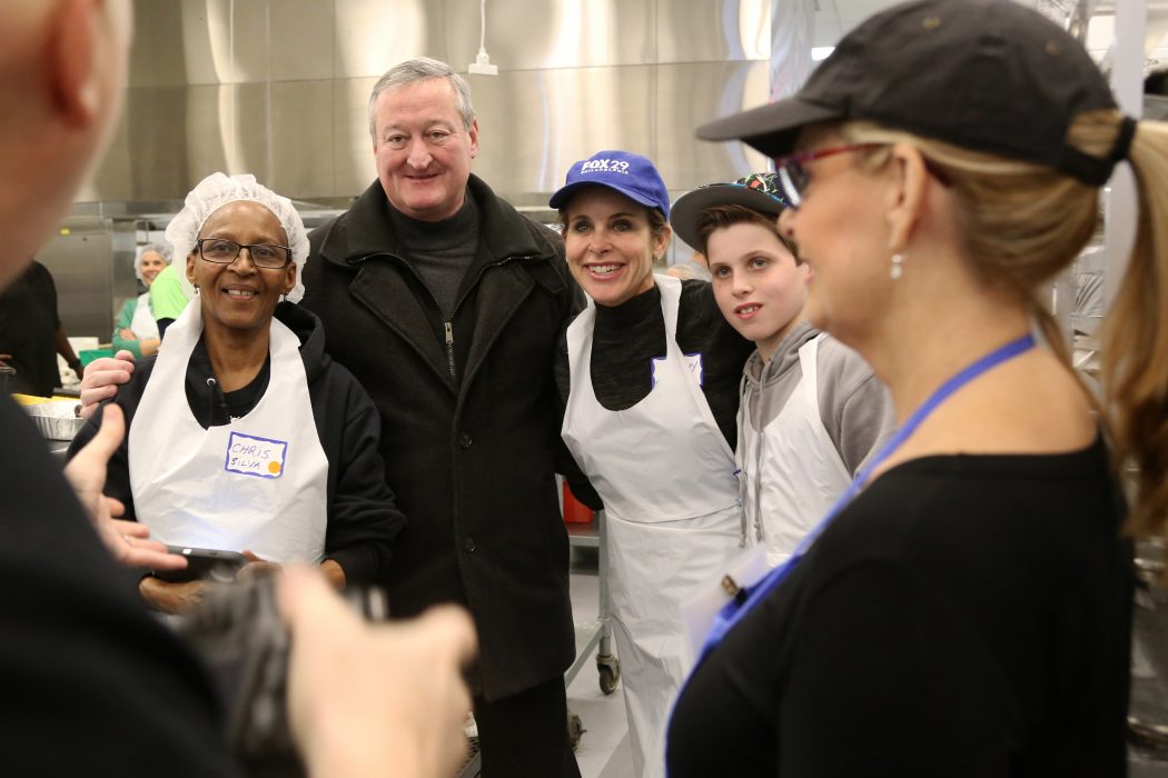 The Mayor poses with a small group of energetic MANNA volunteers .