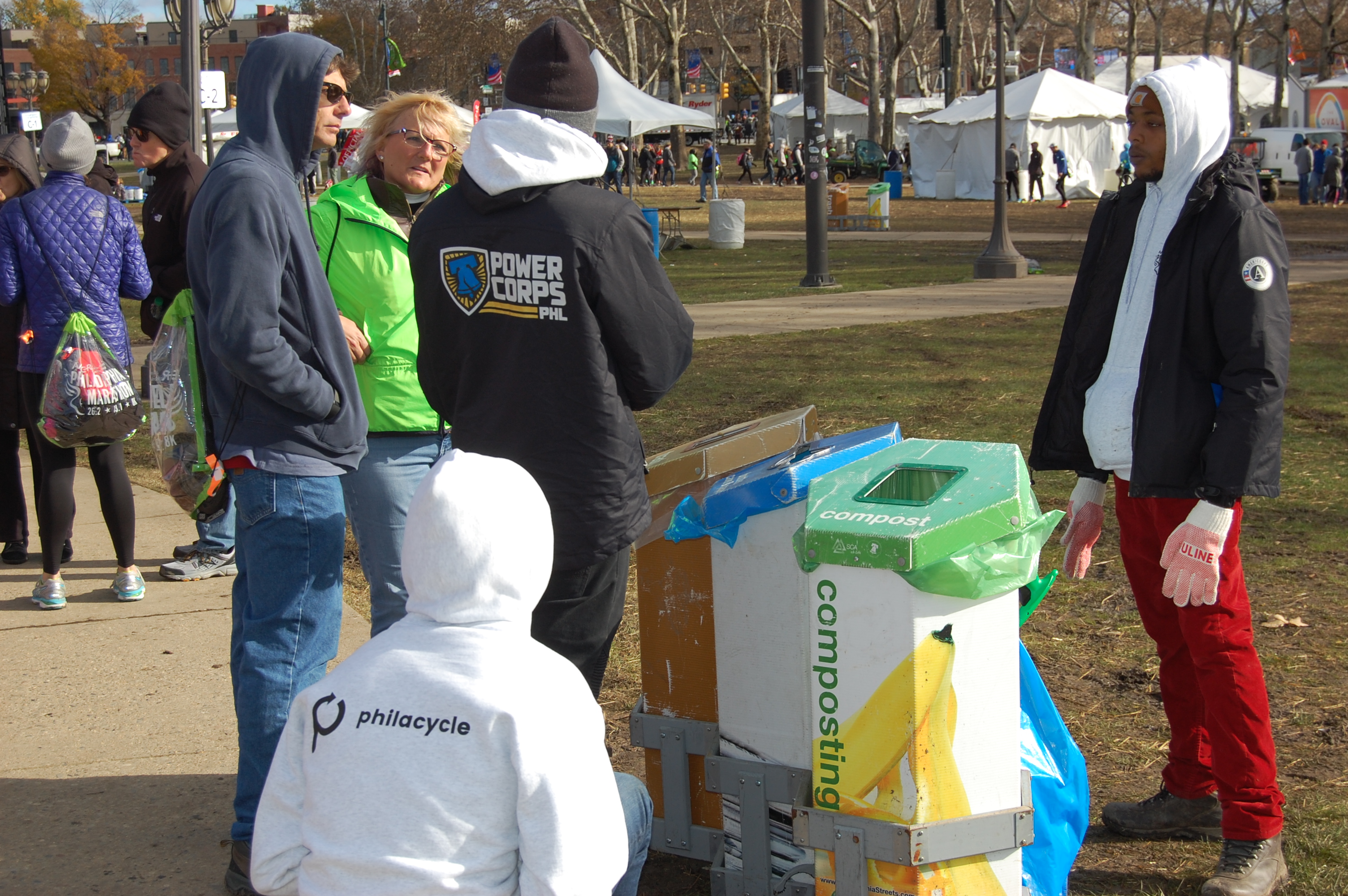 A volunteer describes how to sort waste at the 2017 Philadelphia Marathon