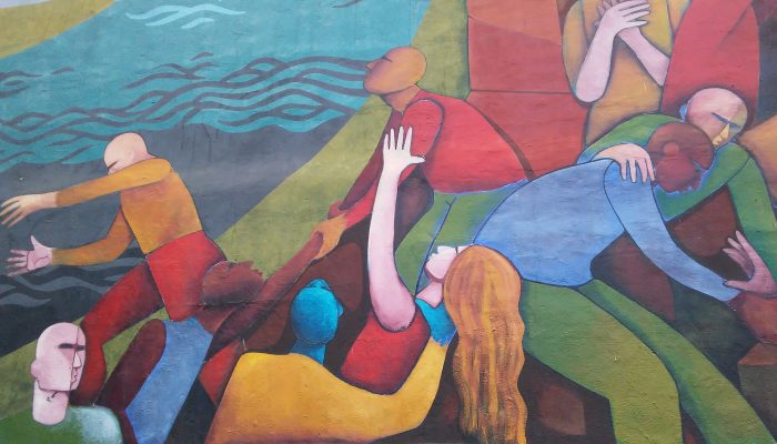 A painting of people holding hands