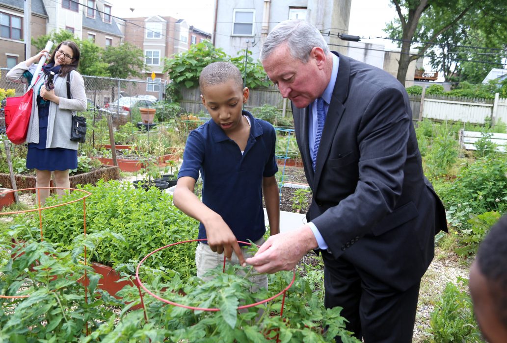 Students from E.M. Stanton Elementary School show Mayor Kenney their community garden after receiving a Green Schools grant from Recyclebank on June 7