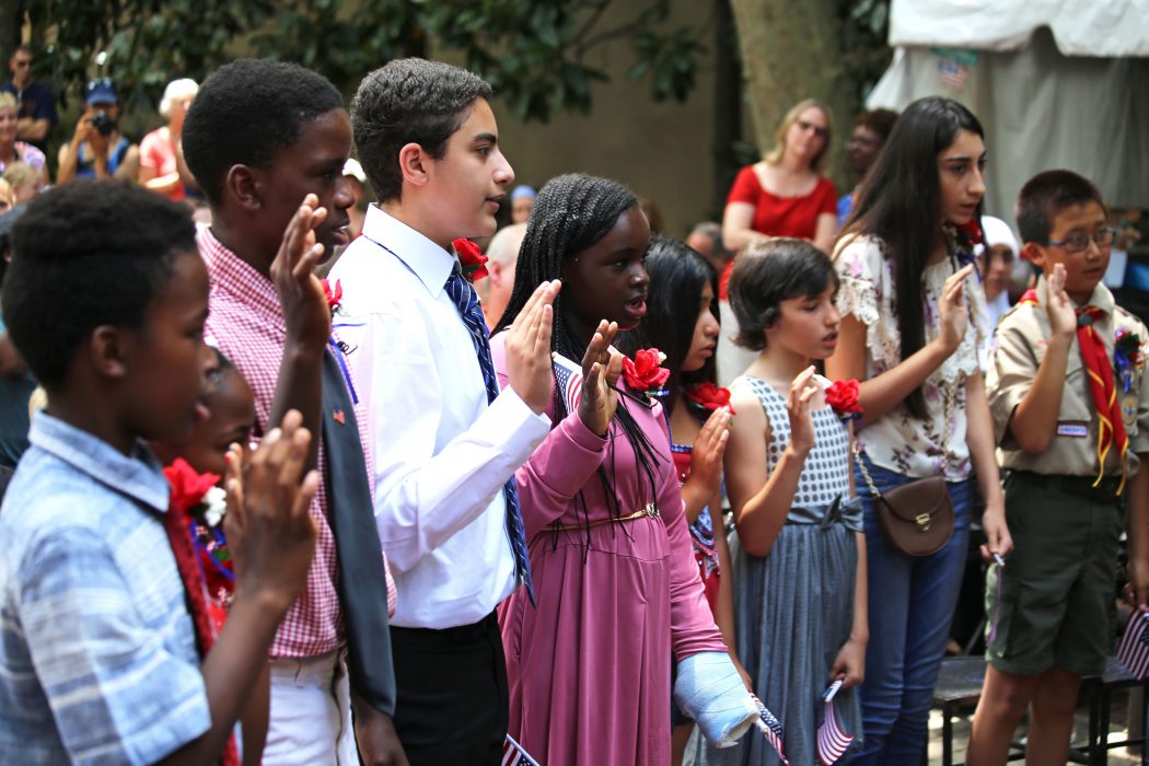 Thirteen children become citizens during a naturalization ceremony on July 4th