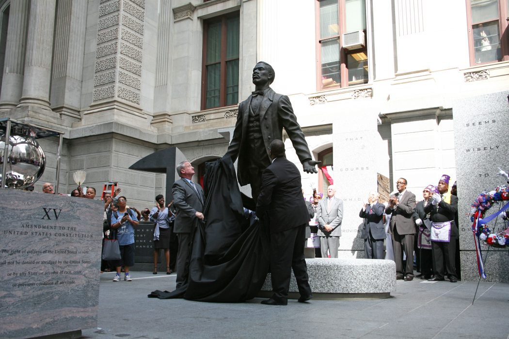 Mayor Kenney and Artist Branly Cadet unveil the Octavius V. Catto monument during a dedication ceremony on September 26