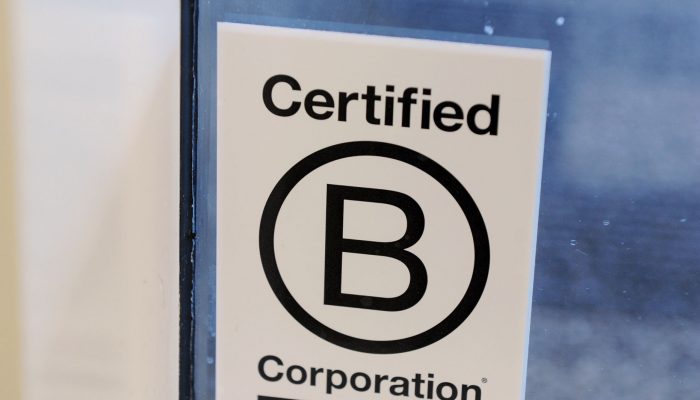 Photograph shows sign that certifies a business as a sustainable B Corportaion