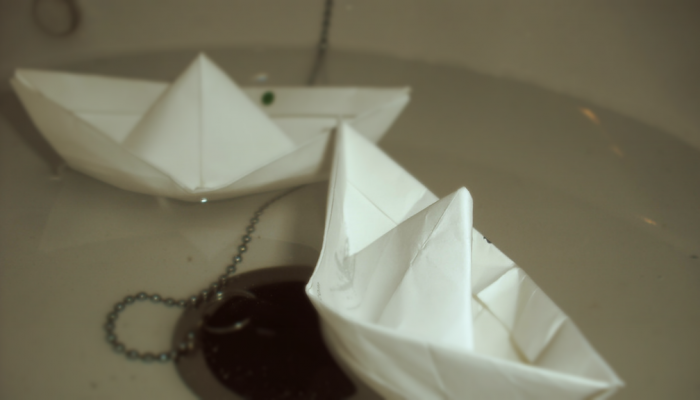 Paper boat floating in a sink by Eleaza on Flickr