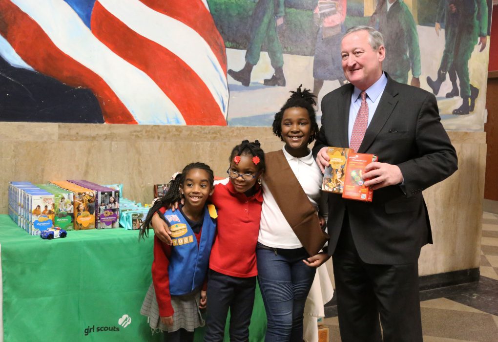 Mayor Kenney buys Girl Scout cookies while visiting the CTE Connect Fair at Murrell Dobbins CTE High School on February 13. 