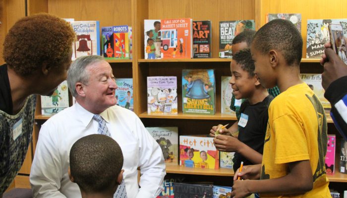 mayor kenney laughing with children at a library