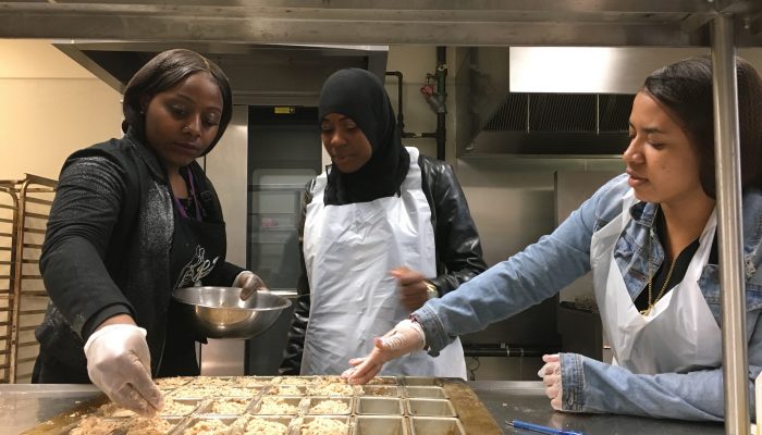 high school students prepare healthy food