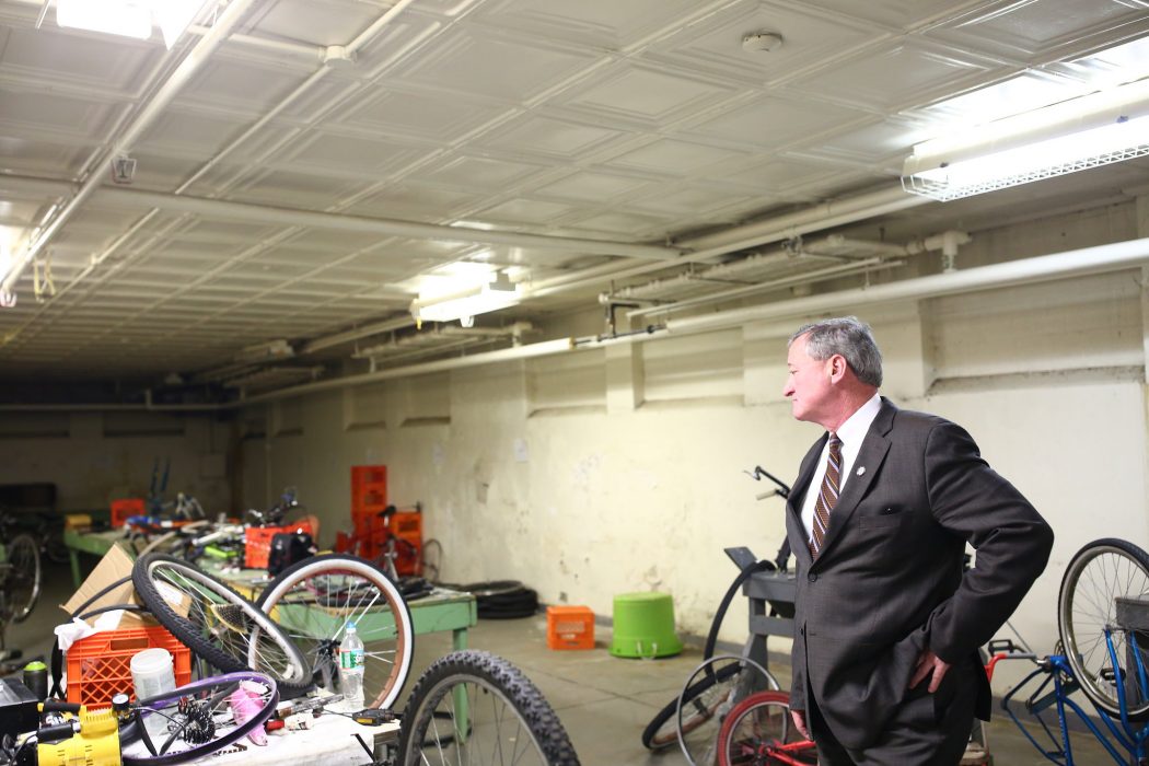Mayor Kenney observes a room a Vare Rec filled with old bikes and equipment
