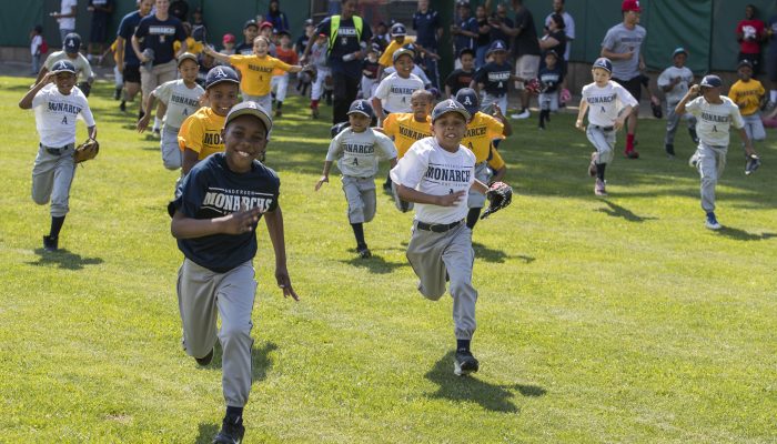 Kids running on to baseball field