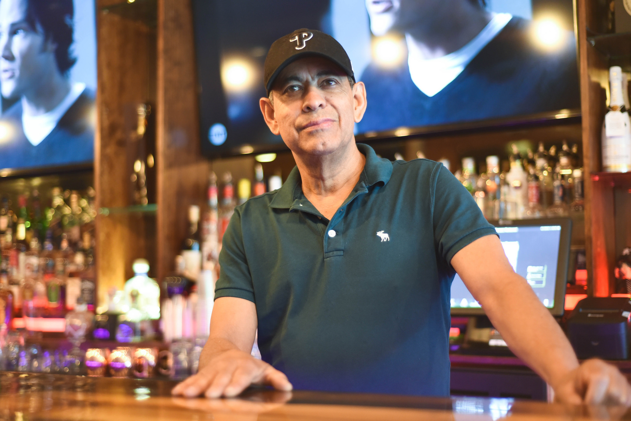 A gentleman standing at the bar at Buccann