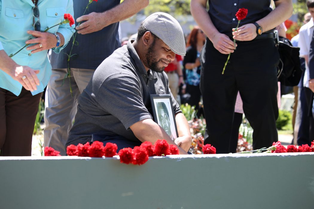 An attendee pays tribute during the Living Flame Memorial Service.