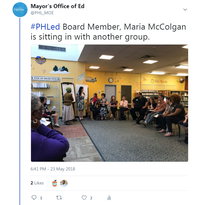 Board member Maria McColgan sits with community members at a listening session