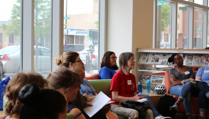 Community members sit together and discuss thoughts on education in Philadelphia