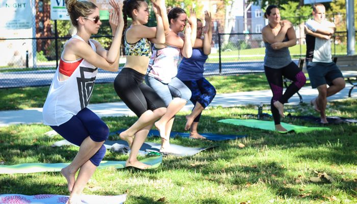 People participating in a yoga class in Dickinson Square Park