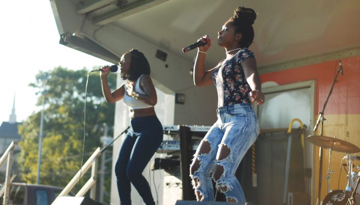 Two women perform on stage at a jazz concert at Morris Estate Cultural Center