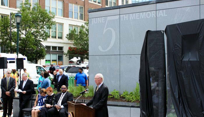 Speaker at podium at June 5 Memorial Park dedication