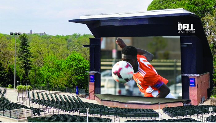 A soccer player displayed on a big screen at the Dell Music Center