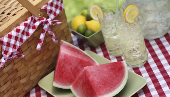 Watermelon and fresh water available at a picnic