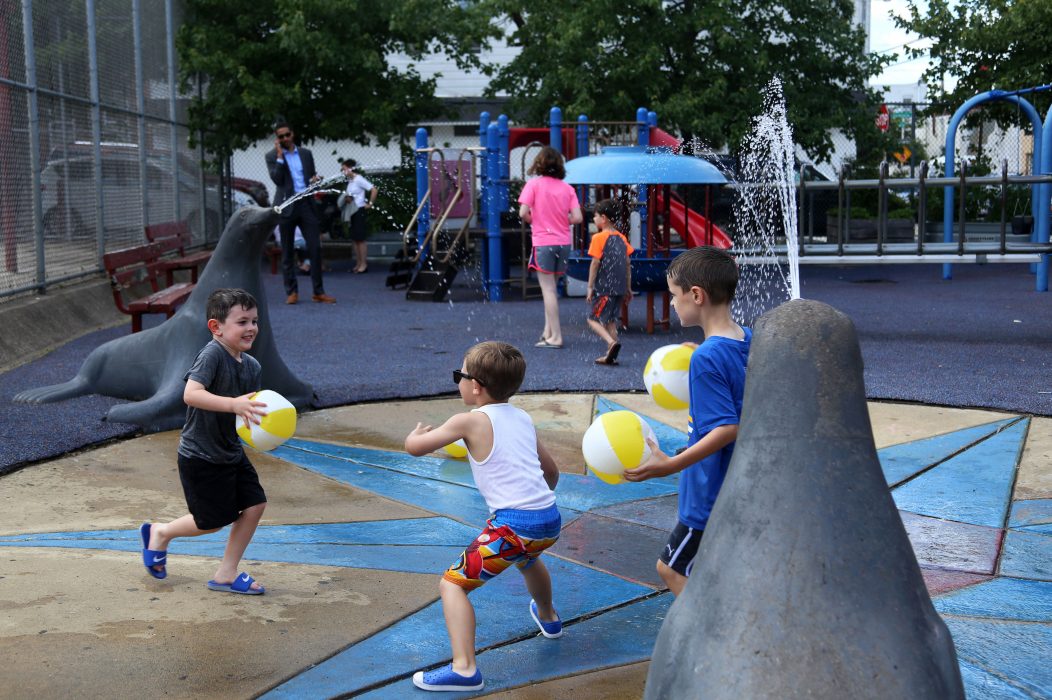 Kids enjoy the sprayground at Glavin Memorial Playground during a Rebuild announcement on June 15.