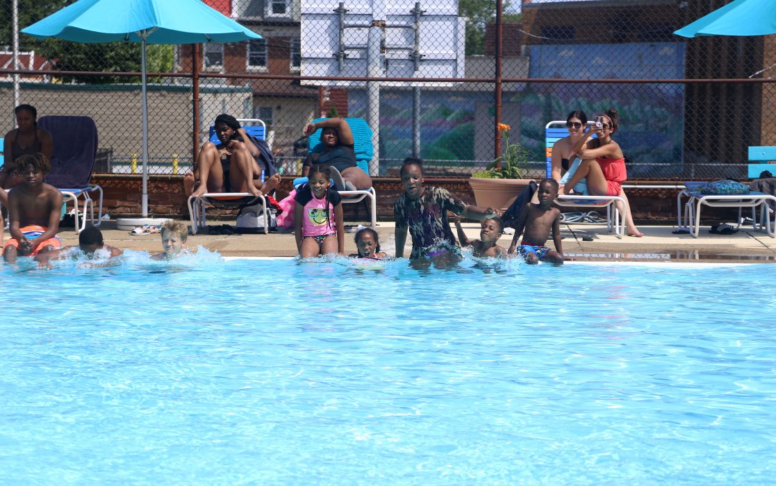 Kids jump in the Lawncrest Recreation Center pool to kick off the opening of City pools on June 19.