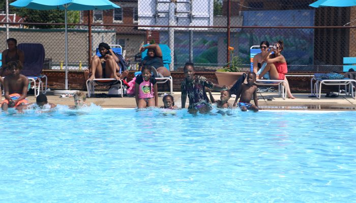 Kids jump in the Lawncrest Recreation Center pool to kick off the opening of City pools on June 19.