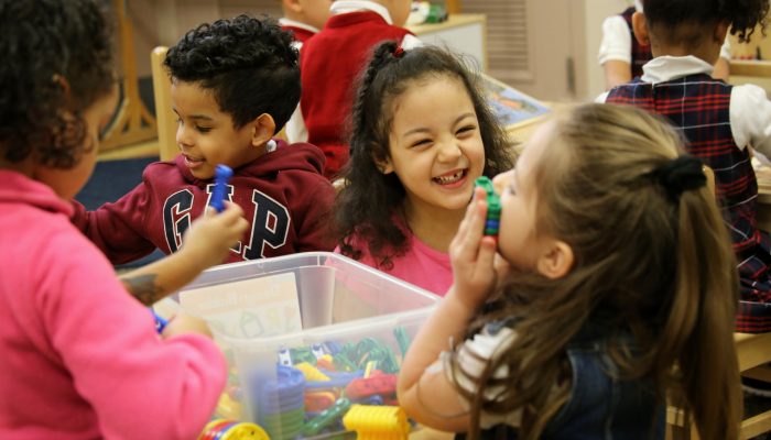 PHLpreK students play and laugh together
