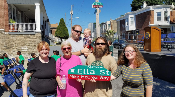 Family members pose with new street sign