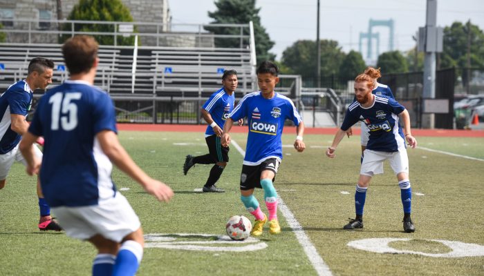 Men competing in a soccer game