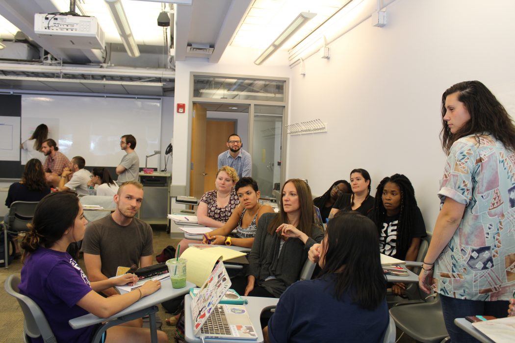 Penn Graduate School of Education intern Frances Felix sits with Penn students in a class and shares her insight