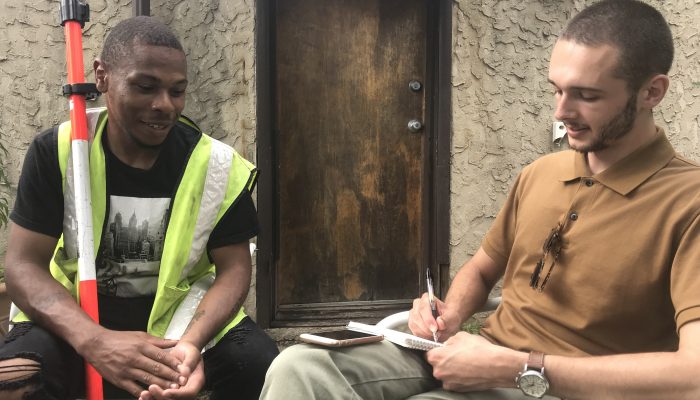 Mayor’s Office of Education intern John Harris and James Burtin from the Streets internship sit outside and talk about James’ experiences